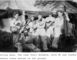 String band "Ledo Trail Winders" in the CBI during WWII, with MC and leader Horace Jones seated on the ground.