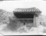 A local alter to a protective deity, apparently Guandi (关帝庙), near Kunming, China, area during WWII.