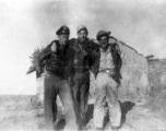 Three American flyers pose together in China during WWII. Stan Mamlock on far left.
