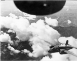 B-25s of the 22nd Bombardment Squadron in flight over rough mountains of SW China or Burma during WWII.