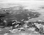 B-25s of the 22nd Bombardment Squadron in flight over rice paddies in SW China, French Indochina, or Burma during WWII.