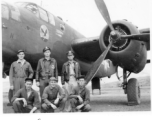 Flyers with B-25 Mitchell bomber.  Rear: Bob Selmer, David Hayward, Jim Curran.  Front: George Scearce (center).  22nd Bombardment Squadron, in the CBI.