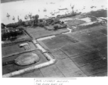 Aerial view showing boats, river, farm plots during mission to bomb Tourane, Indochina, by 22nd Bombardment Squadron in the CBI.  "Our longest mission. The river port of Tourane, French Indochina."