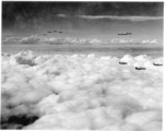 B-24s in flight near Kunming, China, during WWII, including the B-24 "Ubangi Bag II," #241168.