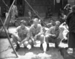 GIs in a market in Luliang, China, during WWII. Soldier in the middle is "Nelson."  From the collection of David Axelrod.
