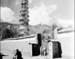 Nationalist troops and guard booths outside pagoda in Dali, Yunnan province, China, during WWII. This is one of three pagodas within a single walled compound. The compound a had been appropriated for use by Nationalist troops. Later, after the communist revolution, the compound was also used by troops, but by PLA troops.