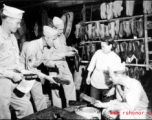 GIs buying shoes in China during WWII.