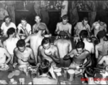 GIs getting a meal at mess on ship on the way back to the US after the war. The ship is probably the SS Marine Raven.