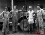 Nash (far left) and Nick Arico (third from left) and others, and the snake, at Luichow, Oct 1944.