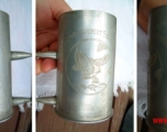 True keepsakes: Views of two mugs made from shell casings, commemorating the 22nd Bombardment Squadron.