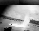 Bombs exploding near Japanese shipping during raid on Hong Kong. Images from bombing mission on Hong Kong, 491st Bomb Squadron.