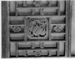 Carved wood panels, usually part of a door or partition.  In Yunnan or Guangxi province. During WWII.