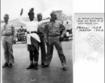 GIs pose with traffic policeman in Karachi, India, March 1942.