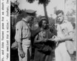 Oscar Chapman, and John Turner pose with a Kachin man at Jorhat, India, during WWII.