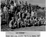 Members of air freight crew, both GIS and local people, in China during WWII.   Front row: Cpl. Stanko, Sgt. V. A. Green, Sgt. Gorer, Pfc. Bartko, Pvt. Spears.  Background on truck: Pvt. Firestone.  Official U.S. Gov image.