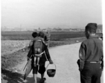 Chinese mother carries baby near Kunming, April 1945.