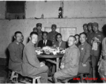 Table of ranking local Nationalist leadership during the banquet at the rally. In foreground, left, is Chinese Lt. General Du Yuming, commander of Nationalist 5th Corps (第五集团军总司令兼昆明防守司令杜聿明). On right is Gen. Wei Lihuang (卫立煌).   The general seated on the far left is Qiu Qingquan (邱清泉).  In the back are two KMT civilian officials. The one on the right is likely An Zefa (安则法), a highly educated official who had a number of roles in Yunnan during WWII.