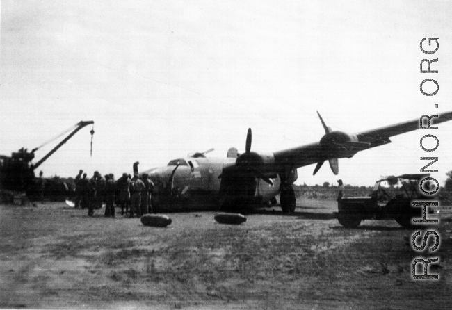 Broken B-24 "WE'REWOLVES", crashed on take-off crash on March 20th, at Panagarh. Upon crash, live bombs were spewed out of the bomb bay. Fortunately the arming pins were still in the fuses. Speculation of some was that the accident was caused by loss of lift due to the negative angle of attack caused by a high speed take-off. The crashed was observed by Majore W. A. Delahay and Capt. T. E. Sledge who had been beside the runway observing 492nd Bomber Squadron planes take of on the mission.