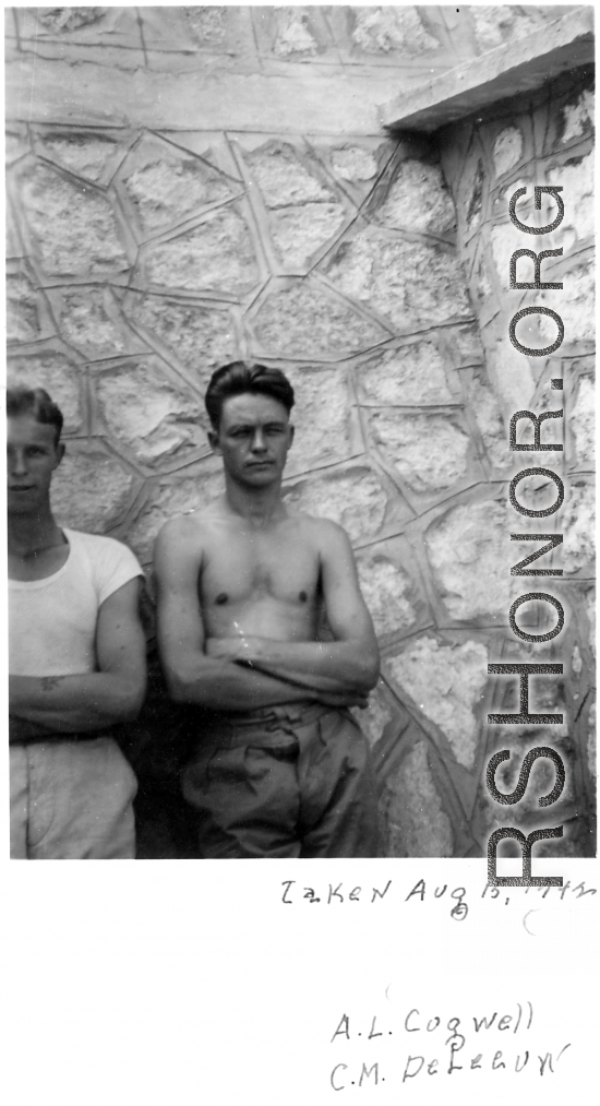 GIs of the 7th Bombardment Group leaning against a rock wall in China, during WWII, August 15, 1942.  Left is A. L. Cogwell, right is C. M. DeLeeuw.