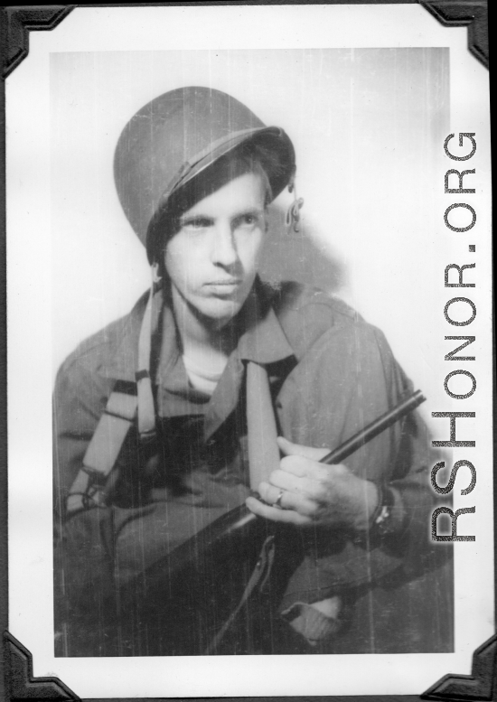 Sgt. Vern P. Martin posing with helmet and carbine in China during WWII.