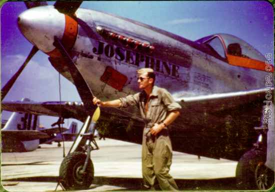 Flyer posing before P-51 "Josephine" in China.  During WWII.