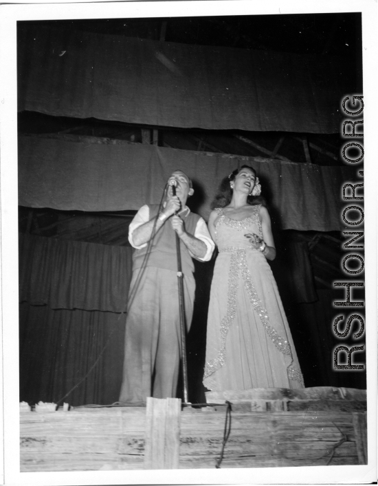 Performers well off the beaten track, providing a break for Burma Road engineers of the 797th Engineer Forestry Company--Pat O'Brien and Jinx Falkenburg perform  During WWII.