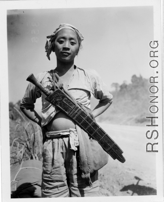 Local people in Burma near the 797th Engineer Forestry Company--a man with a large knife.  During WWII.