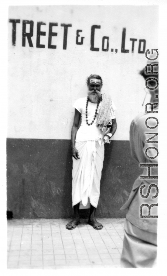 A GI takes picture of sadhu in India, as seen by men of the 2005th Ordnance Maintenance Company, 28th Air Depot Group, in India during WWII.