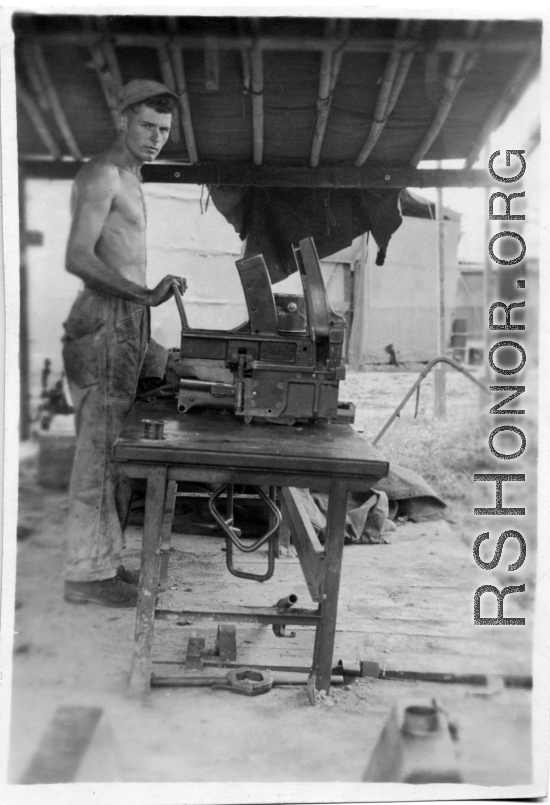 Men of the 2005th Ordnance Maintenance Company,  28th Air Depot Group, working on a gun in Burma. During WWII.