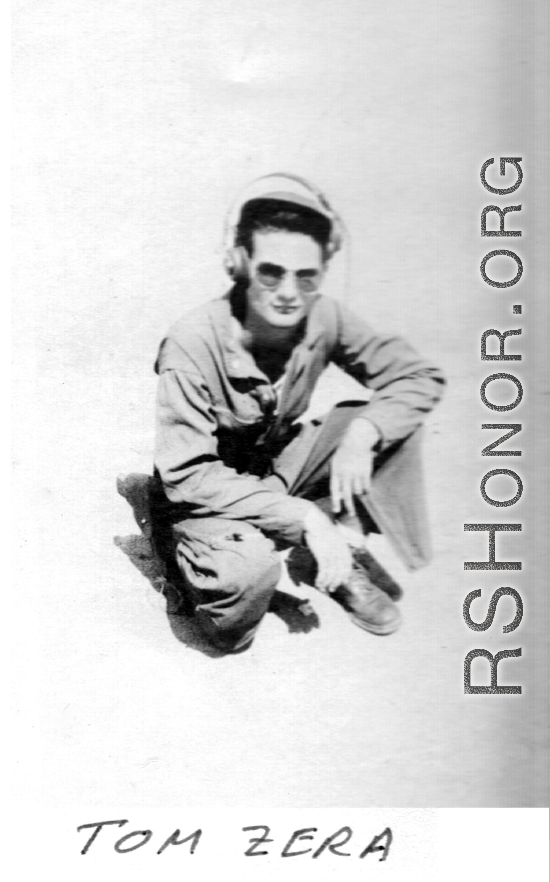 American flyer Tom Zera kneeling on ground.  22nd Bombardment Squadron, in the CBI.