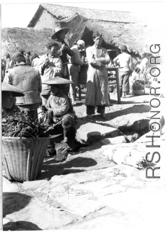 Open-air market in village near and American base is SW China. 22nd Bombardment Squadron, during WWII.