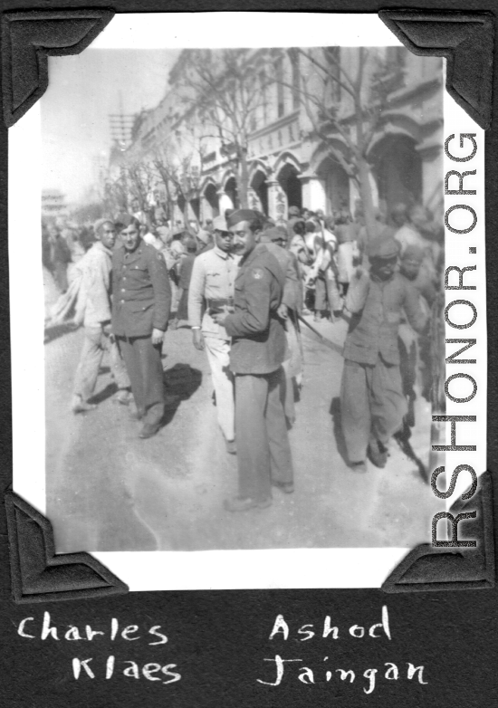 Radar mechanics Charles Klaes and Ashod Janigian among bustling crowds in Kunming, Yunnan, China. During WWII.