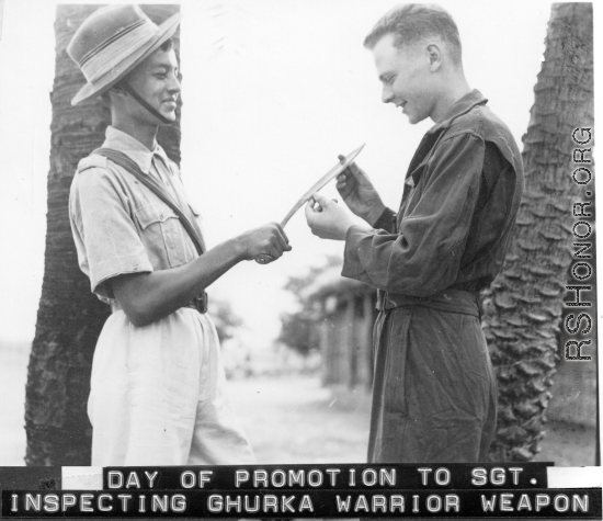 John Wolfshorndl inspects Ghurka knife at an American base in India, during WWII. On the day he had been promoted to Sergeant.