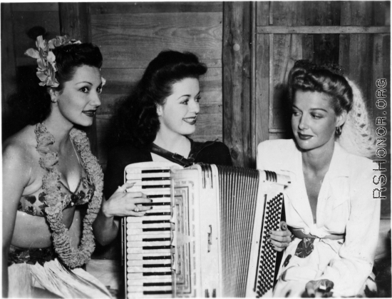 Celebrities visit and perform at Yangkai, Yunnan province, during WWII: Jinx Falkenburg, Ruth Dennis, and Ann Sheridan pose together.