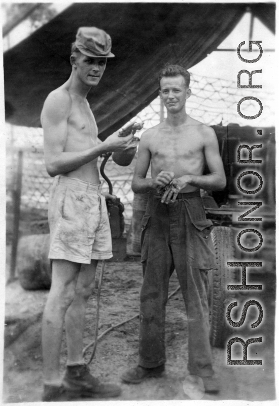 Men of 2005th Ordnance Maintenance Company, 28th Air Depot Group, prepare to spray paint anti-aircraft gun in Burma during WWII.