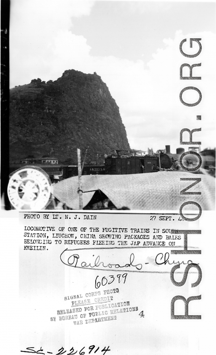 September 27, 1944. During WWII, a locomotive of one of the fugitive trains in south station, Liuchow, China, showing packages and bales belonging to refugees fleeing the Japanese advance on Kweilin (Guilin). Photo by Lt. N. J. Dain