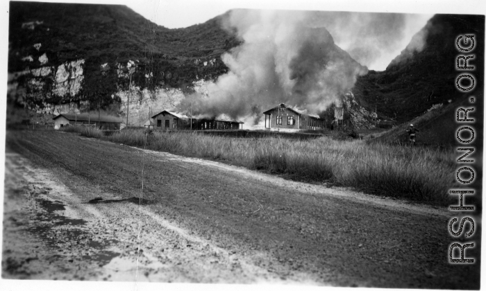 American hostels at the base burn during the American and Chinese retreat before the Japanese arrive during the Ichigo push in the fall of 1944. Guangxi province, Liuzhou air base.