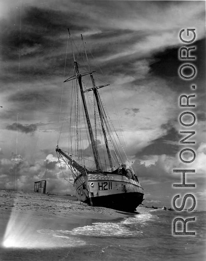 Boat 'Icaros" ground on the sandy shore in India.  Scenes in India witnessed by American GIs during WWII. For many Americans of that era, with their limited experience traveling, the everyday sights and sounds overseas were new, intriguing, and photo worthy.