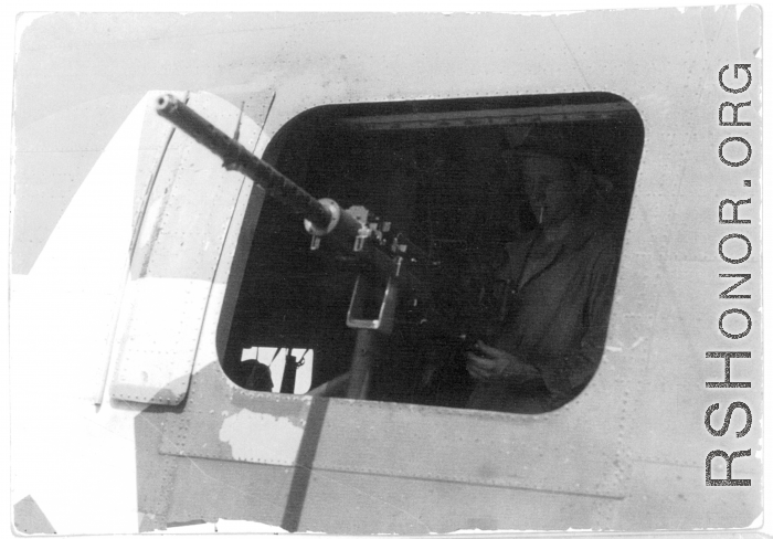 Gunner at waist gun of B-24 in the CBI during WWII.