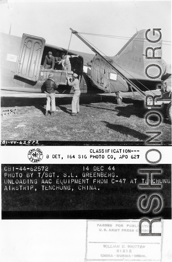 Unloadeding AAC equipment from C-47 at Tengchong airstrip.  December 14, 1944.  Photo by T/Sgt. S. L. Greenberg. 164th Signal Photographic Company, APO 627.  Passed by William E. Whitten.