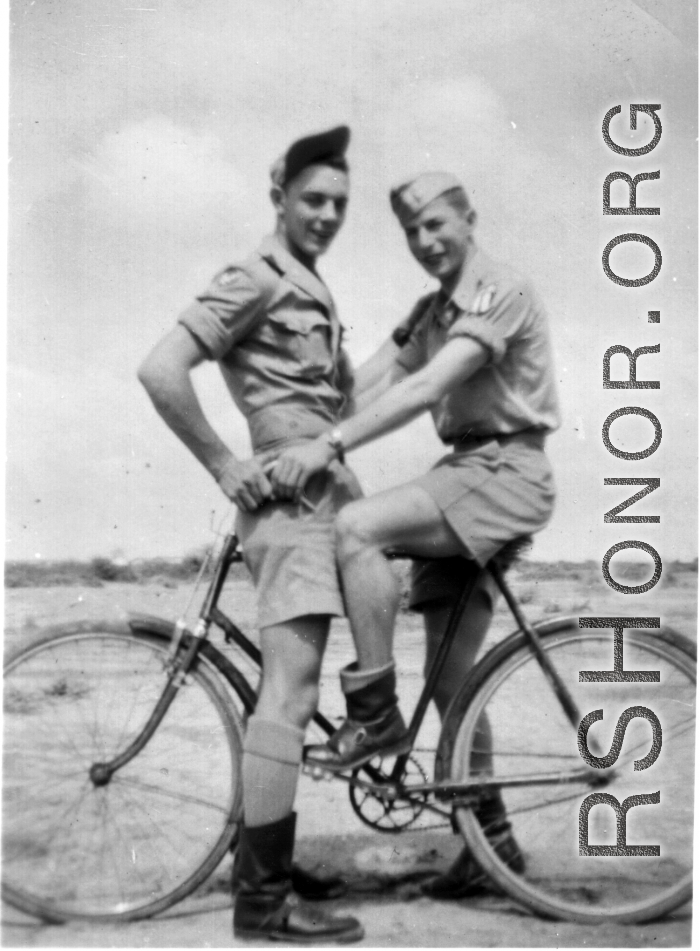 Two flyers goof on a bicycle in the CBI during WWII. Stanley Mamlock on the right.