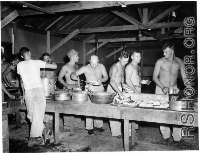 GIs of the 797th Engineer Forestry Company in Burma, getting chow.  During WWII.