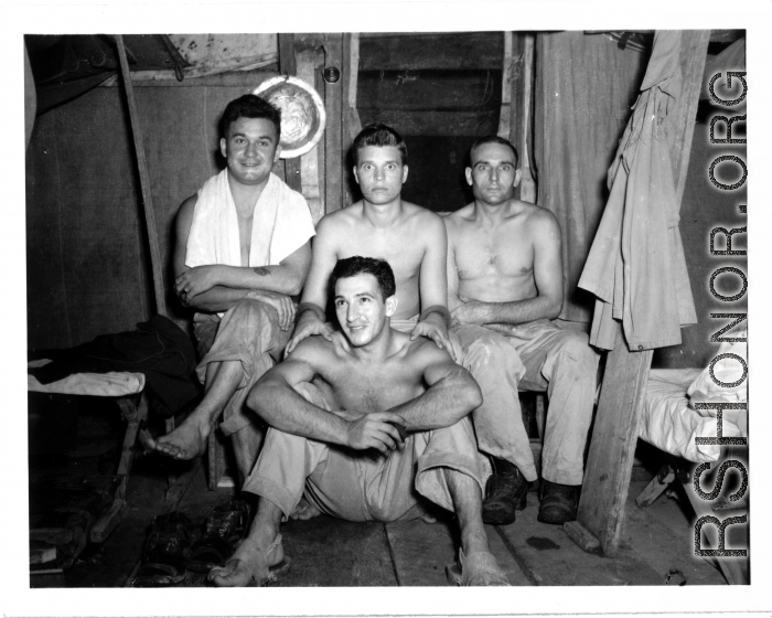 Engineers of the 797th Engineer Forestry Company pose in their barracks in Burma.  During WWII.