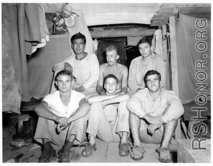 Engineers of the 797th Engineer Forestry Company pose in their barracks in Burma.  During WWII.