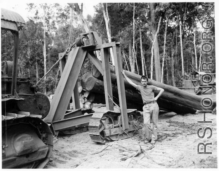 797th Engineer Forestry Company in Burma, loading logs for milling for bridge building along the Burma Road.  During WWII.
