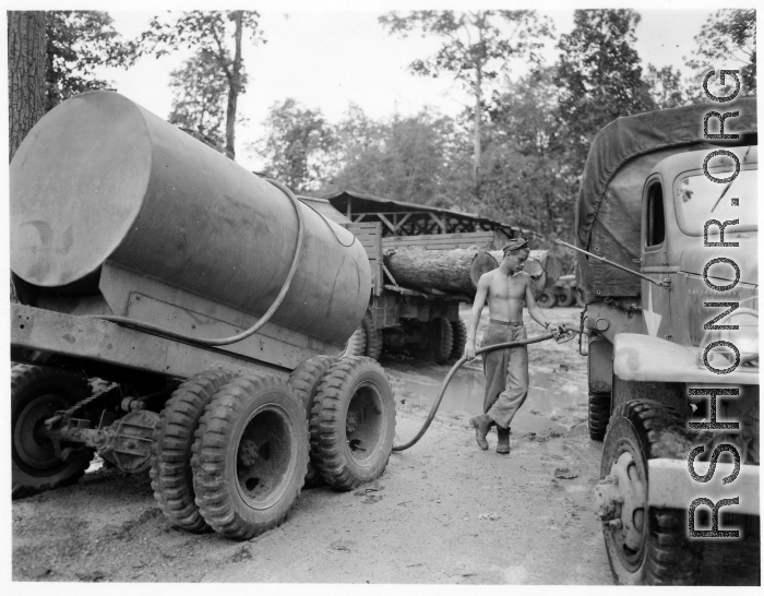 797th Engineer Forestry Company in Burma, GI fuels logging truck along the Burma Road.  During WWII.