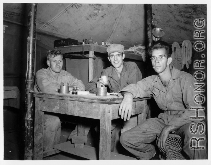 Engineers of the 797th Engineer Forestry Company pose in their barracks in Burma.  During WWII.