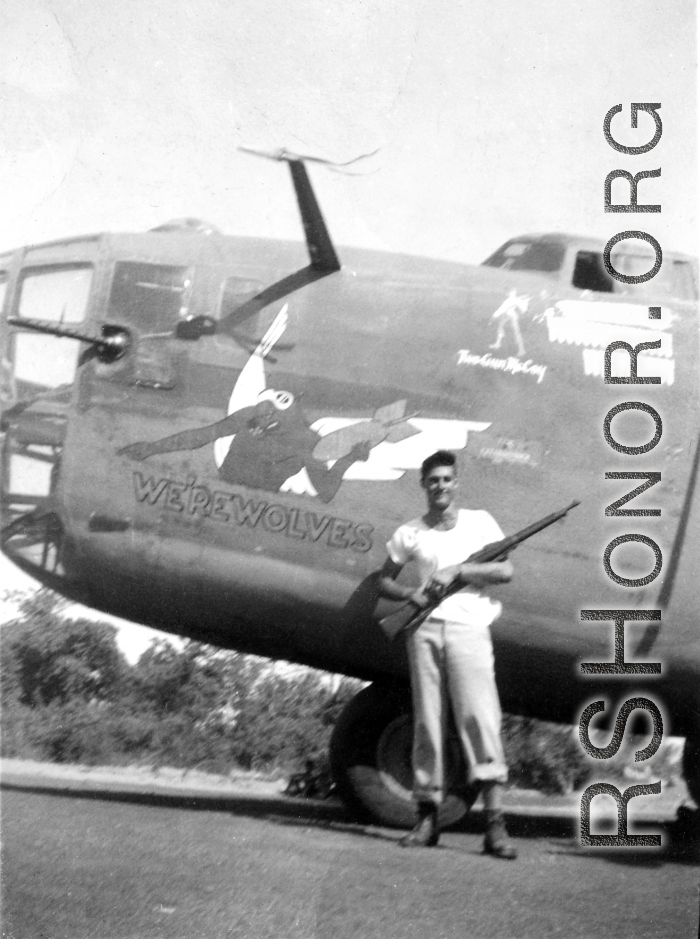 Pilot Edward "Two-Gun" McCoy posing with M1903 "Springfield" rifle in 1943 before his plane, B-24 WE'REWOLVES. His stance matches the image of him painted by Thomas Grady near the pilot's window, above him.  (Thanks to John Olin for supplemental info about his grandfather "Two-Gun" McCoy!)