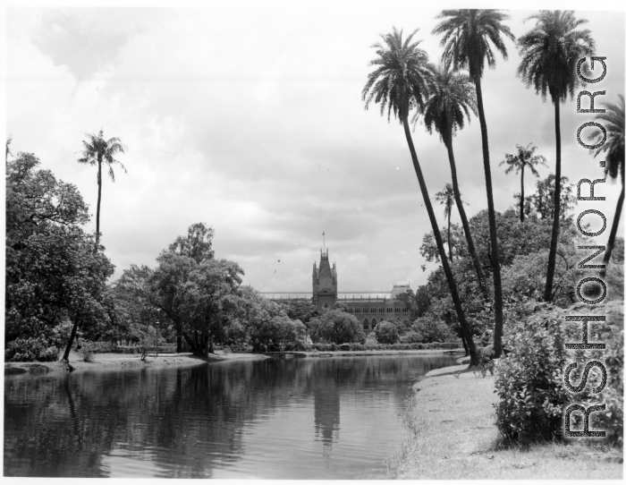 Ornate building on manicured grounds.  Scenes in India witnessed by American GIs during WWII. For many Americans of that era, with their limited experience traveling, the everyday sights and sounds overseas were new, intriguing, and photo worthy.