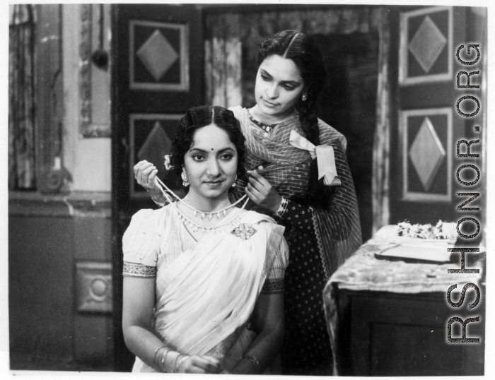 Purchased image with scene from an Indian movie.  Scenes in India witnessed by American GIs during WWII. For many Americans of that era, with their limited experience traveling, the everyday sights and sounds overseas were new, intriguing, and photo worthy.
